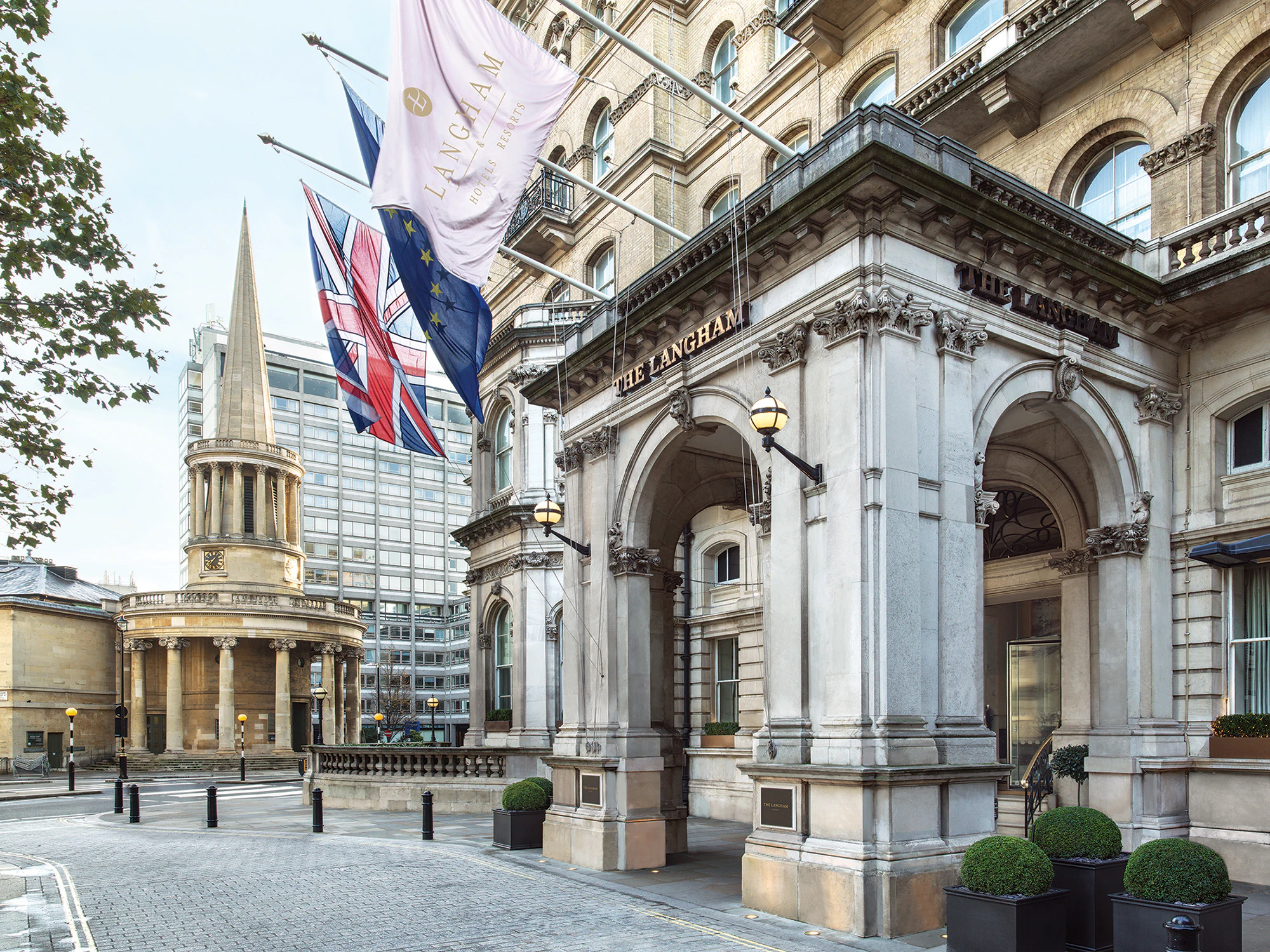 Entrance of The Langham in London with All Souls Church, Langham Place in the background.