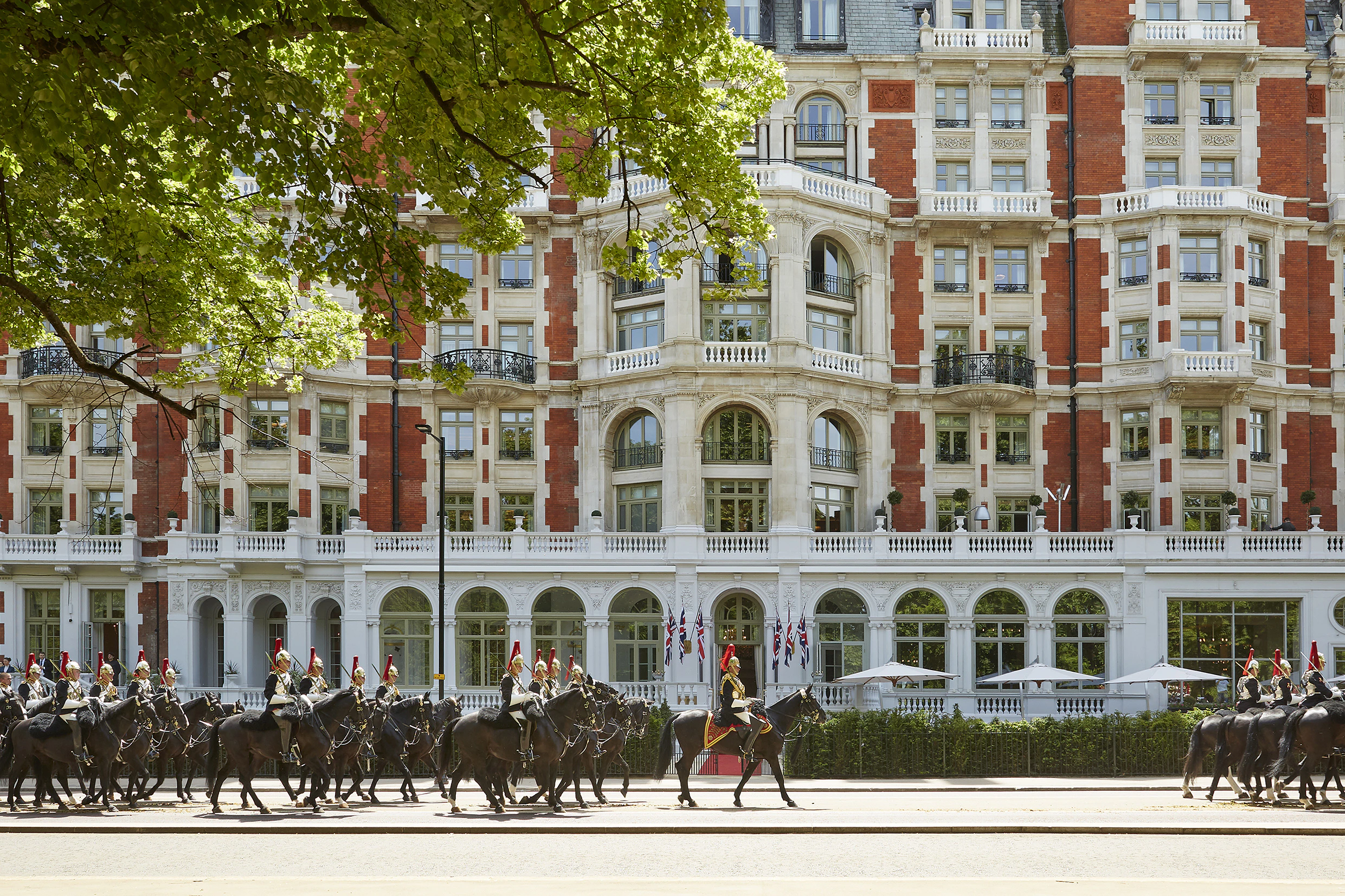 Mandarin Oriental Hyde Park, with the Household Cavalry parading past its entrance.