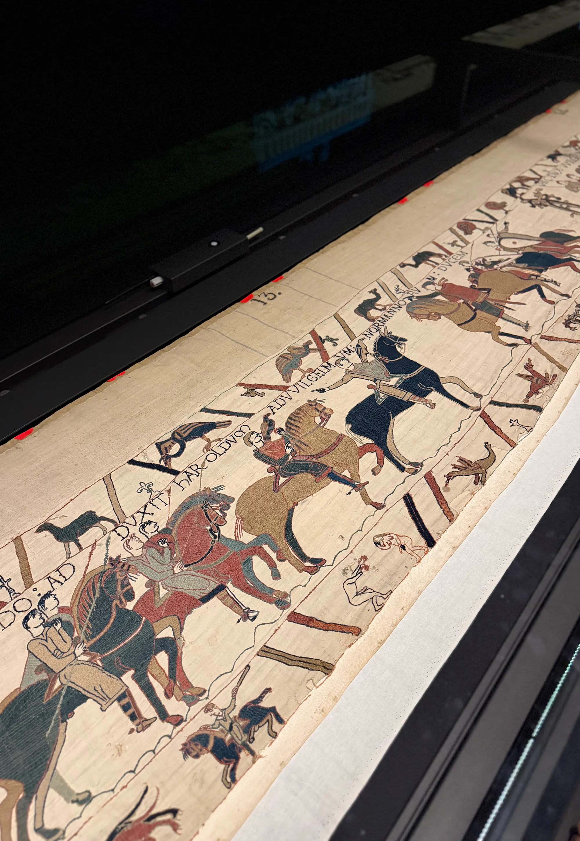 The Bayeux Tapestry on display at the British Museum, its stitched knights and Latin captions.